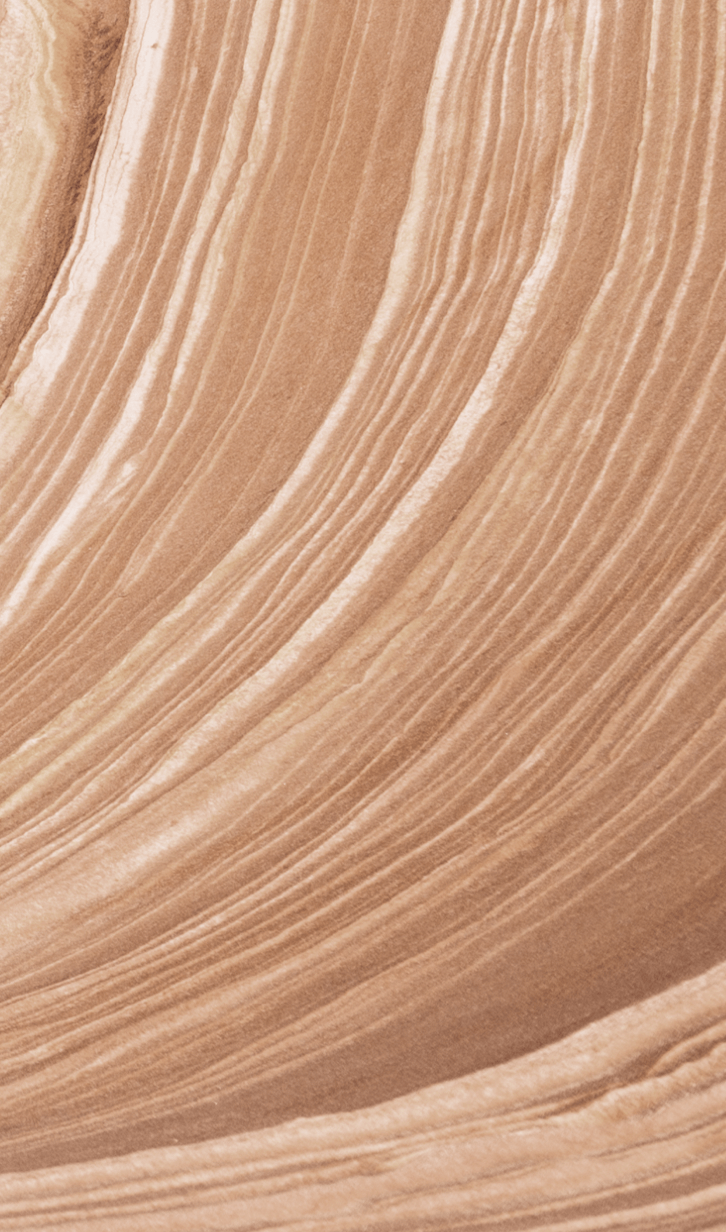 Behind the Cafe Mocha flavor bottle, we see a wavy rock texture with alternating shades of brown.